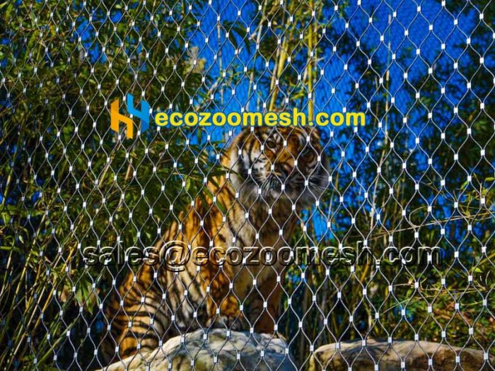 zoo animal enclosures including bird and tiger are made of hand-woven netting mesh