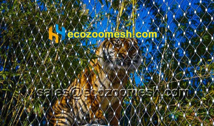 zoo animal enclosures including bird and tiger are made of hand-woven netting mesh