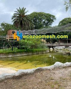 there is a tunnel mesh for monkey in the zoo