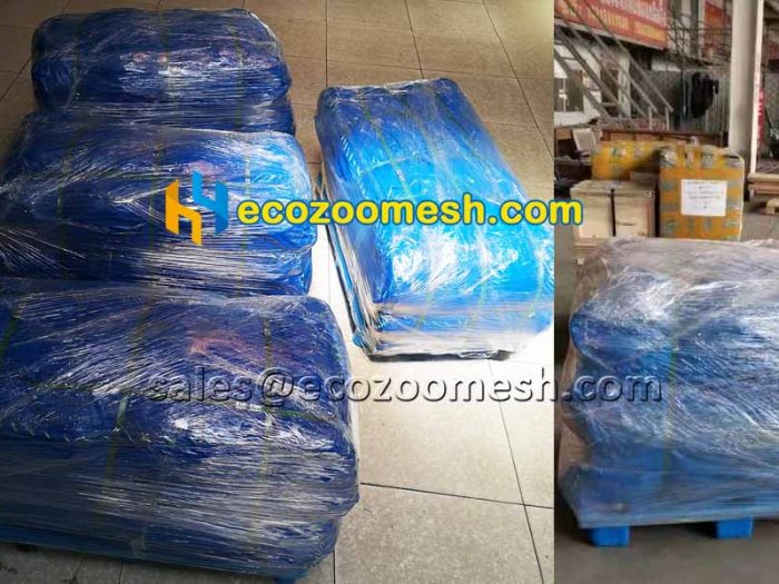 there are four pallets of stainless steel wire rope woven mesh waiting for shipping.