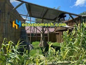 this monkey cage fence made of black steel mesh fence